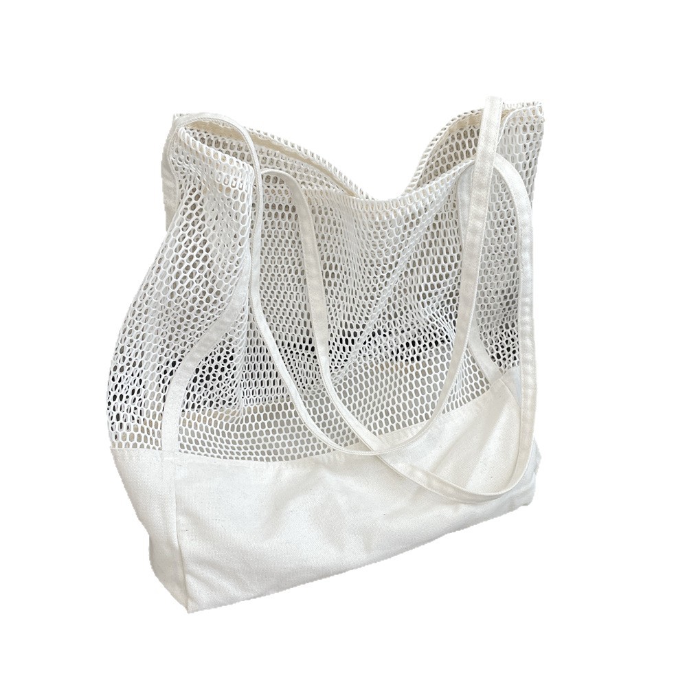 55211 Solid color hollowed-out large-capacity tote bag, mesh travel beach bag, single-shoulder bag, canvas shopping bag for women Item Picture