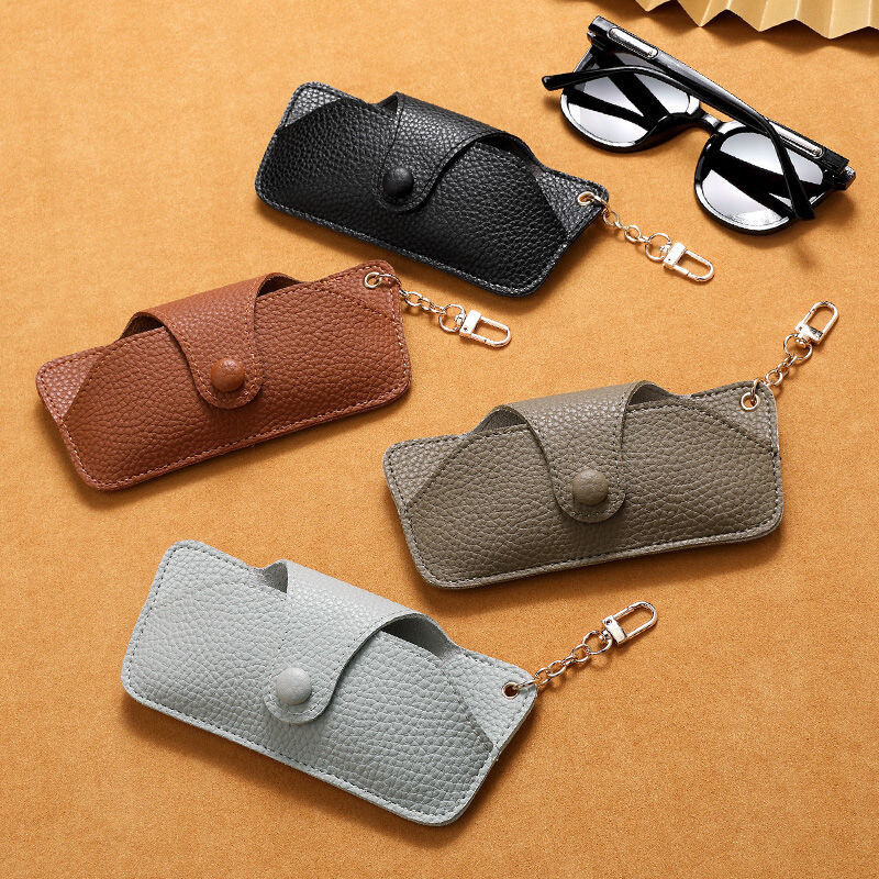 Light luxury European and American pressed handcrafted leather sunglasses case, anti-drop sunglasses case, portable eyeglass bag, chain hanging bag full figure