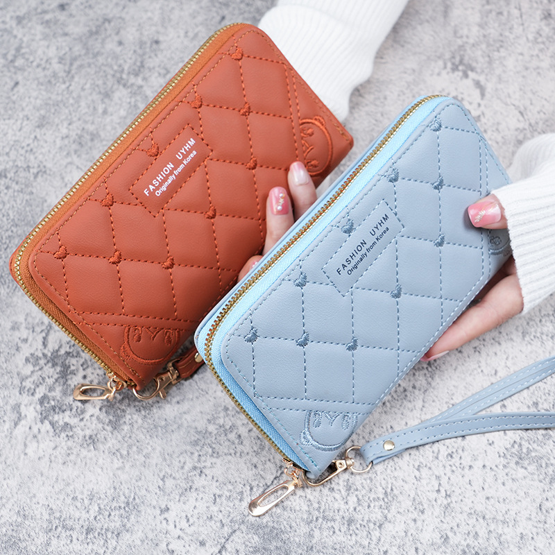 A fresh and sweet mid-length women's wallet in stock for the 2023 summer. It's a solid-color PU leather embroidered wallet Application Scenario