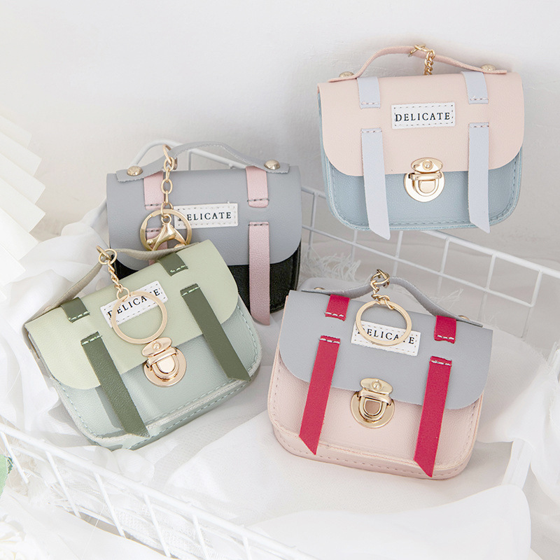 Wholesale of cute female creative mini and small wallets, lid-style lock coin cases, keychains, pendants, and small wallets full figure