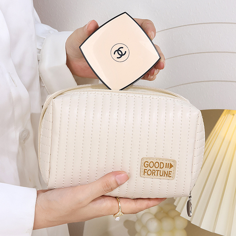 High-appearance-level portable small PU hand-held makeup bag, travel cosmetics storage bag mouth, red envelope makeup bag wholesale full figure