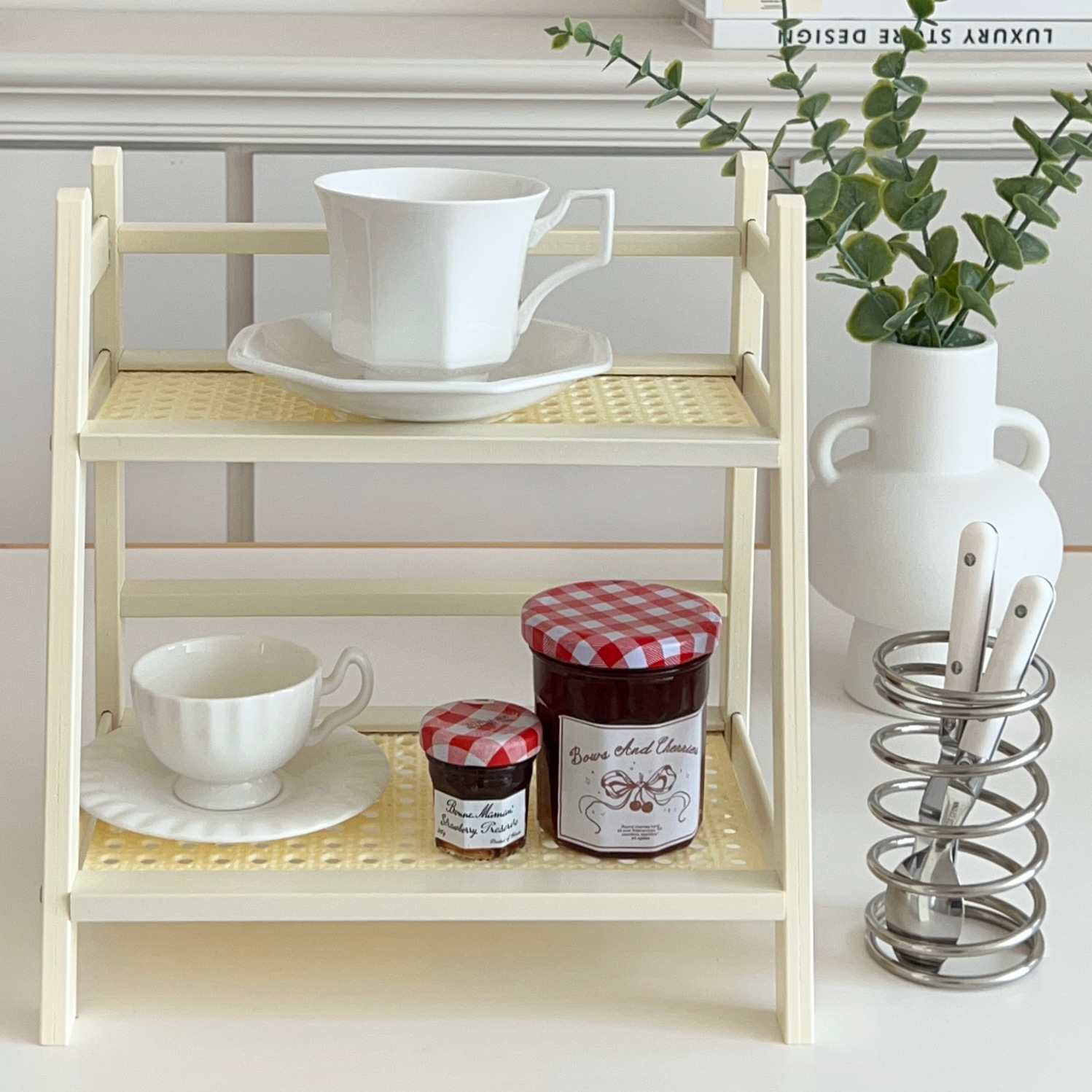 Cream-style rattan cup storage rack, multi-layer desktop miscellaneous storage rack, dormitory kitchen organizing rack Application Scenario