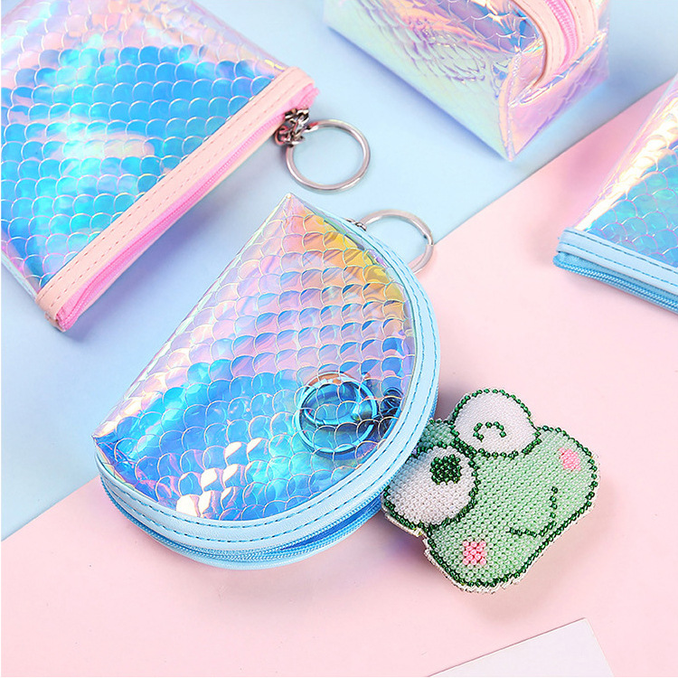 A mini, cute and compact coin purse for women, holding a transparent pvc keychain for convenient coin storage Application Scenario