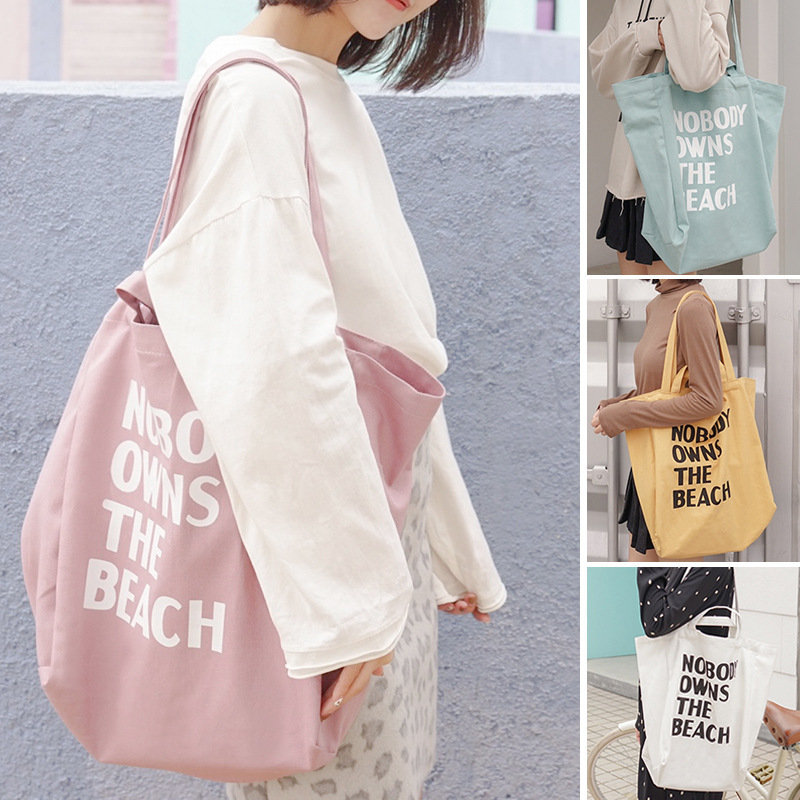 E132 Korean version artistic and simple letter single-shoulder canvas bag for female students, large-capacity hand-held shopping bag for sourcing details Picture