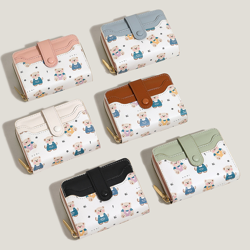 The new women's wallet features cute dinosaur print snap fasteners, short design, anti-demagnetization, multiple slots, large capacity and a high-end feel full figure