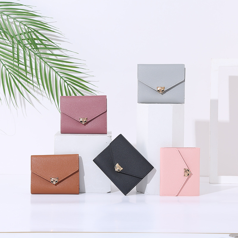 Wholesale of 2021 new style wallets for female junior high school students, short and fashionable Korean-style hand-held bags in solid colors and versatile wallets full figure