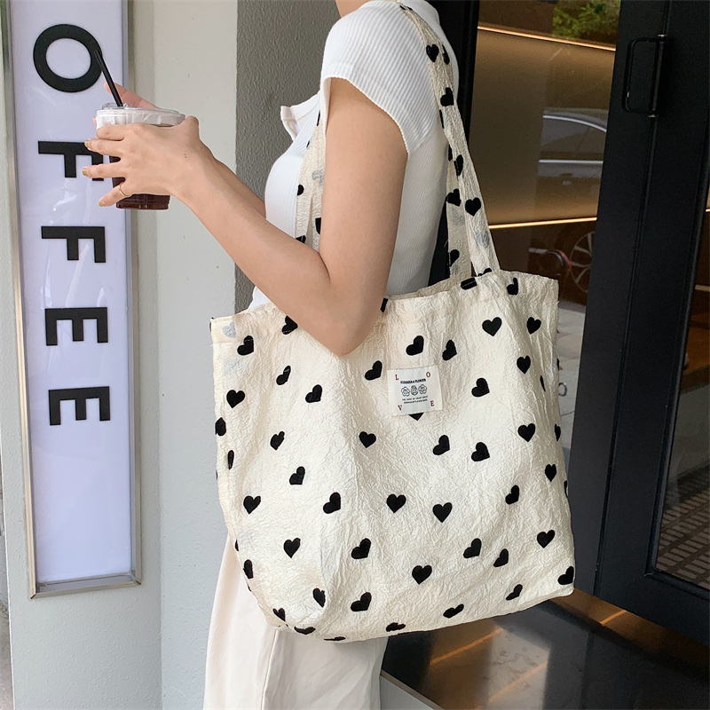 36252 New textured heart-shaped canvas single-shoulder backpack, large-capacity handbag, makeup bag, student underarm bag full figure