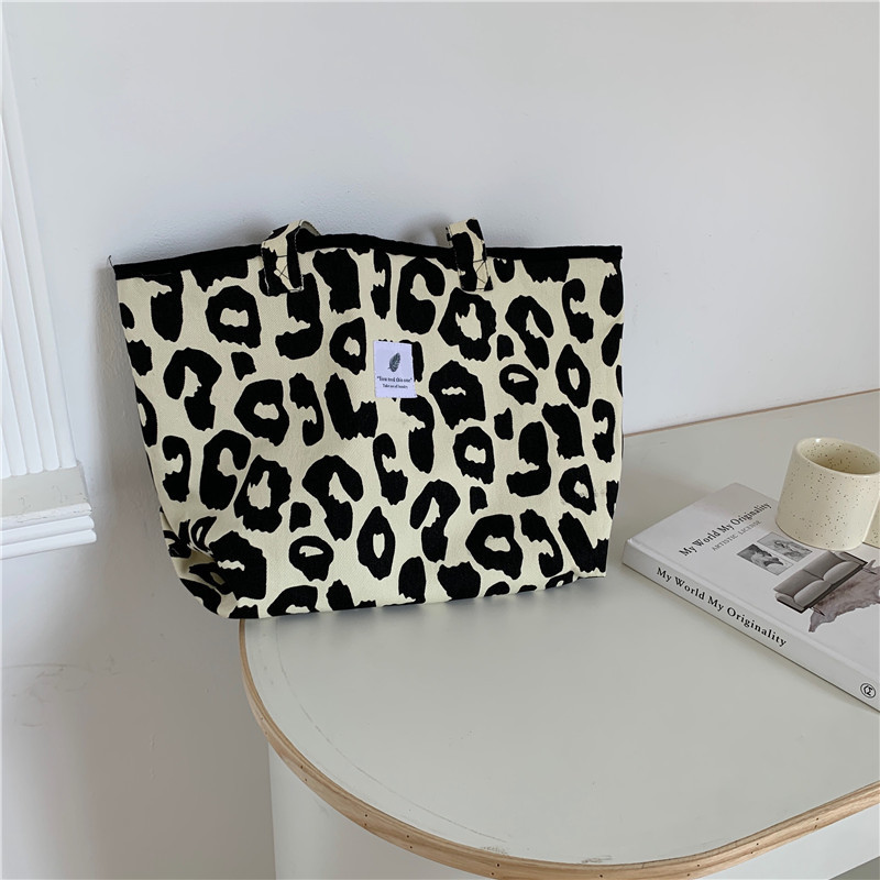 16291 Stylish rice leopard print tote bag, large-capacity animal-print canvas single-shoulder bag, hand-held female student shopping bag Item Picture