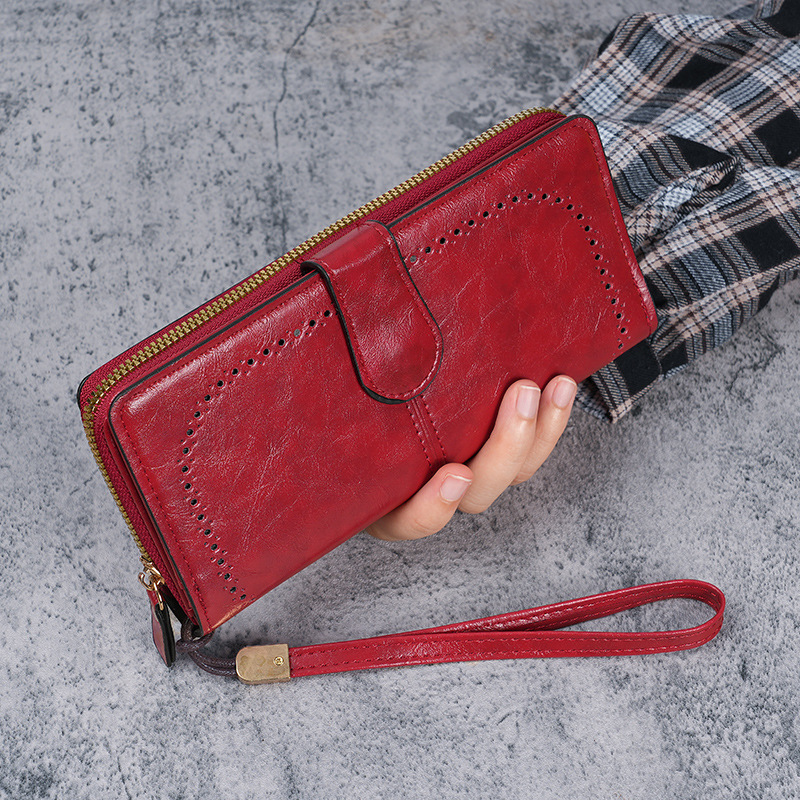 The manufacturer wholesals new fashionable oil-wax leather large-capacity wallets for women, long and large banknote holders, and hollowed-out wallets for women details Picture
