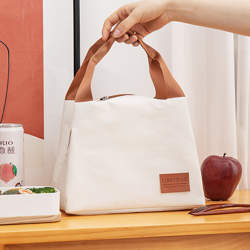 The new insulated bento bag has a high appearance level. It is a square handbag made of Oxford cloth, a portable lunch box for bringing meals to work Specification drawing