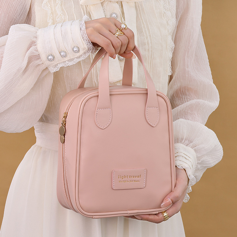 High-appearance-level PU cream handbag, toiletry bag, large-capacity, fashionable, waterproof, dirt-resistant and simple storage bag for travel full figure