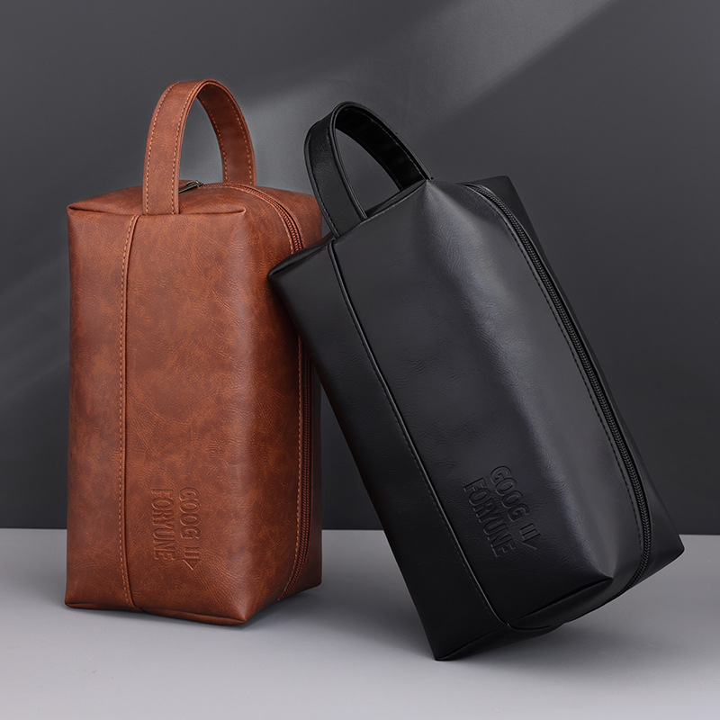 A niche design hand-held men's makeup bag with a large capacity, high-end feel, portable, waterproof and multi-functional cosmetics storage bag full figure