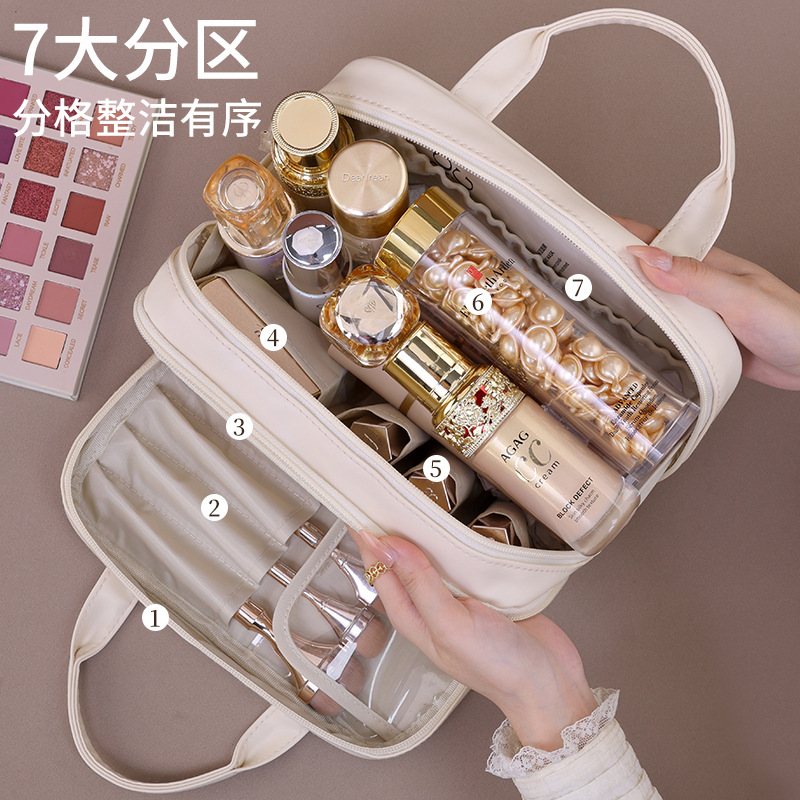Double-layer hand-held cosmetic bag with large capacity, high-end feel, and a niche design for women's portable cosmetics storage. Minimum order quantity: one details Picture