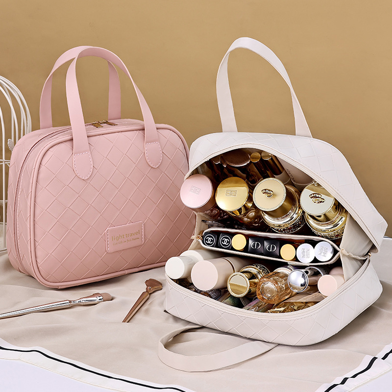 A new large-capacity hand-held tagi cosmetic bag with a woven checkered crescent shape and a high-end feel, featuring waterproof compartments for storage Application Scenario