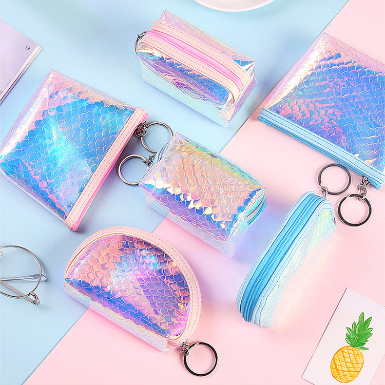 A mini, cute and compact coin purse for women, holding a transparent pvc keychain for convenient coin storage full figure