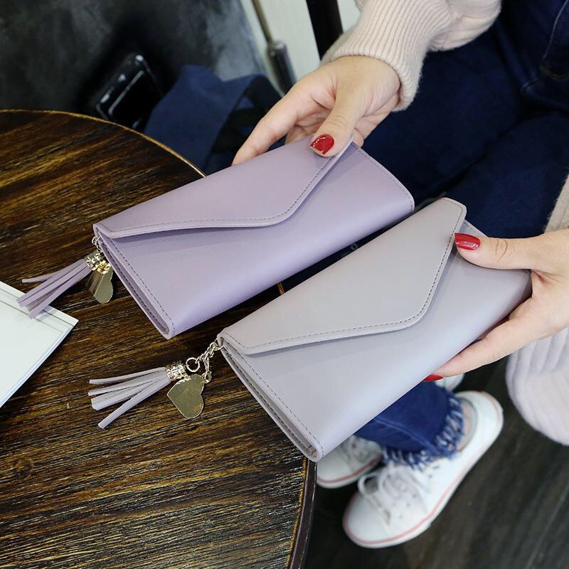 2019 Spring/Summer new long hand-held trendy heart-shaped pendant, simple, fashionable and multi-functional women's wallet with lychee pattern Application Scenario
