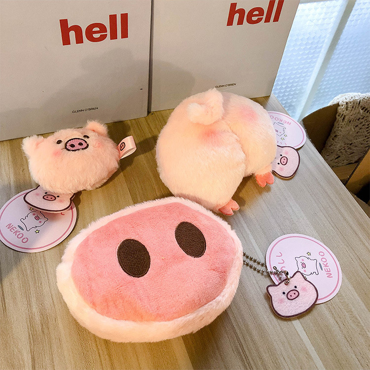 A trendy pig-nosed plush coin purse with an Ins-style cute mini cartoon headphone case and keychain pendant full figure