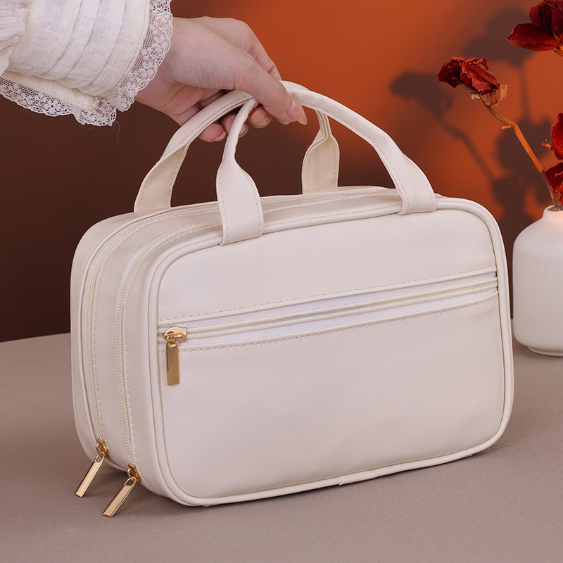 Double-layer hand-held cosmetic bag with large capacity, high-end feel, and a niche design for women's portable cosmetics storage. Minimum order quantity: one Specification drawing