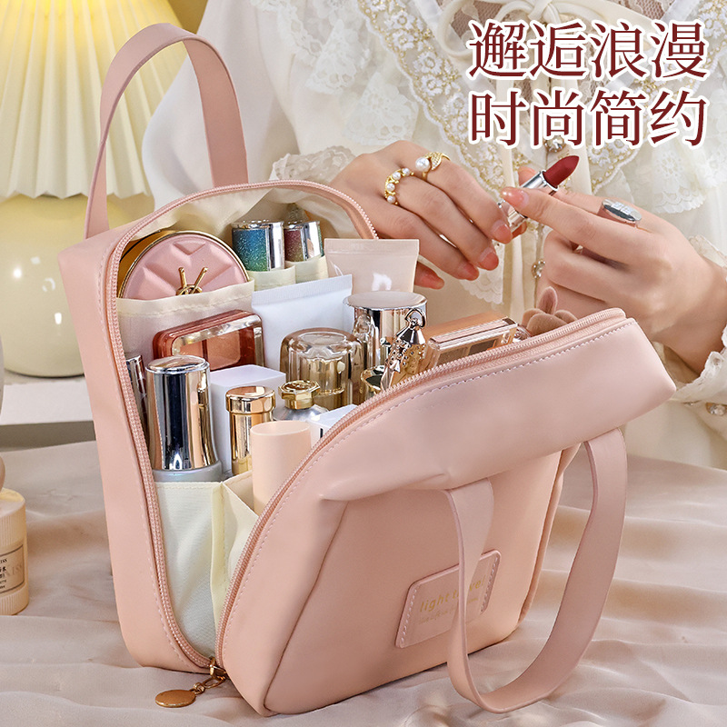 Customized shell hand-held makeup bag, women's portable large-capacity, ins style high appearance level storage bag, travel toiletries bag details Picture