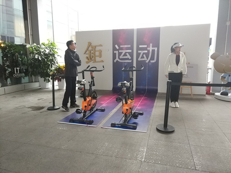 The celebration features multiple people renting foot devices, warm-up props, cycling, generating electricity from each bike, and interactive white races Specification drawing