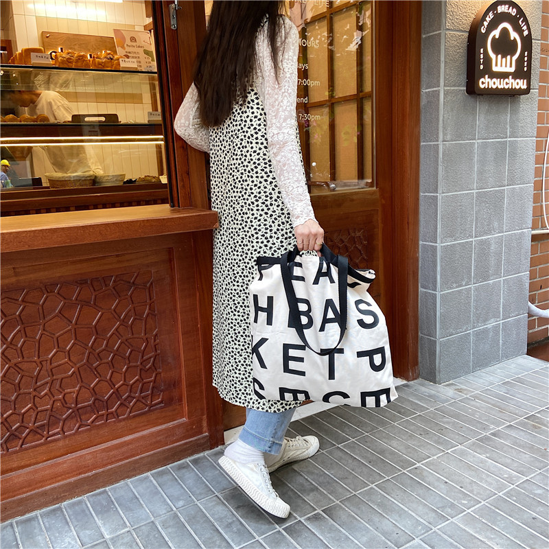 12281 Korean same style letter logo laid-back style large capacity shopping bag canvas bag wholesale in three colors details Picture