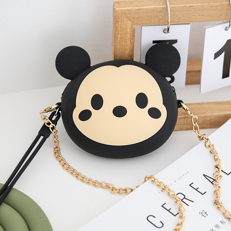 A cute and petite Korean girl's mini zipper wrist cartoon silicone coin purse is slung diagonally across a small bag for storing coins Specification drawing