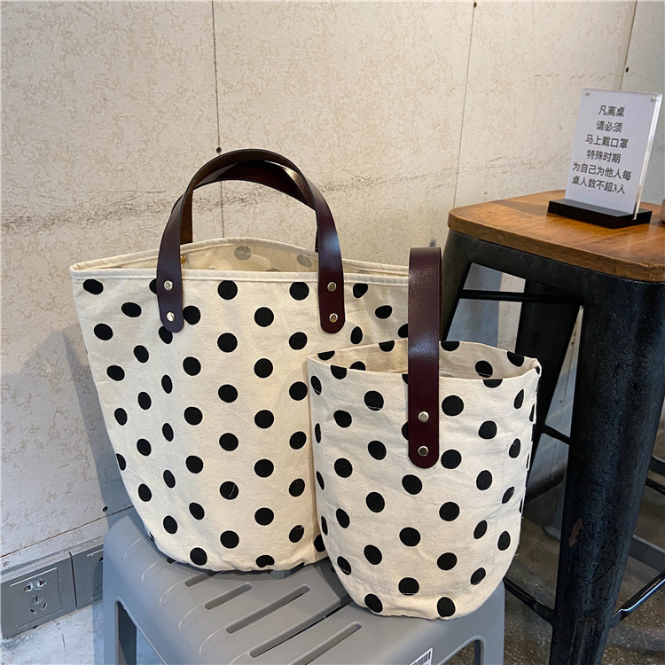 0542 ins French retro polka dot hand-held canvas bag, lunch box, hand-held bucket bag for women full figure
