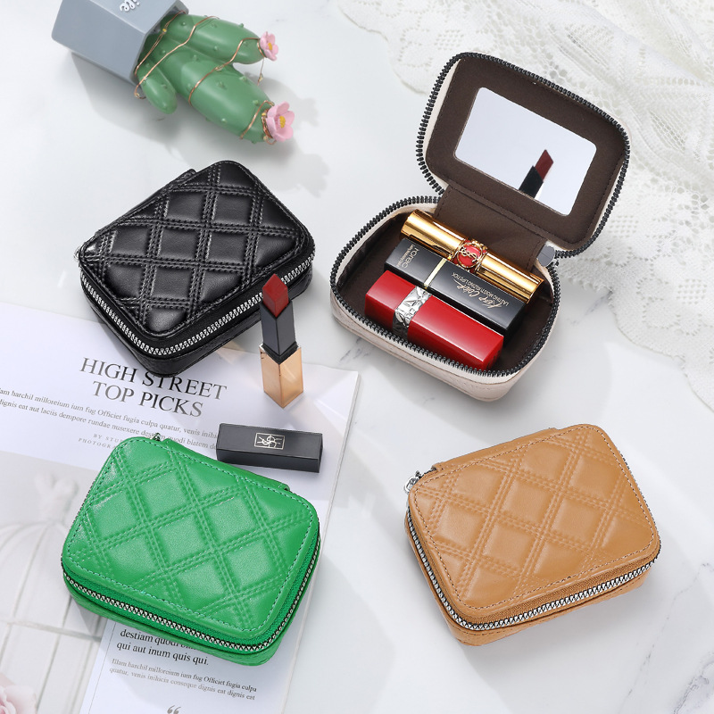 A small mini makeup bag made of pu leather with a red envelope, a fashionable three-in-one lipstick with a mirror full figure