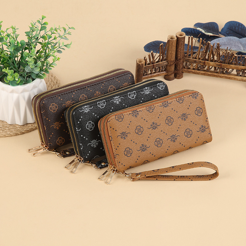 Wholesale of new niche European and American trend printed double-zipper long large-capacity multi-functional wallet clutch bags full figure