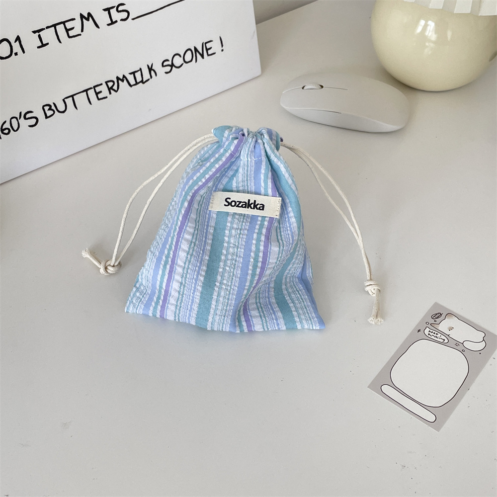 46132 Pleated striped drawstring storage bag, cosmetic bag, miscellaneous opening, red envelope, coin bag, travel sorting bag Application Scenario