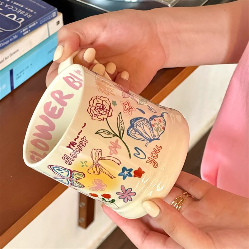High-appearation-level mugs, playful graffiti butterflies, cream-colored ceramic cups, office coffee cups, couple breakfast cups details Picture