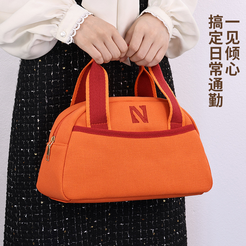 Fashionable commuting handbag for women, with a unique and high-end feel, large-capacity and elegant canvas bento bag, and storage bag for business trips and travels full figure