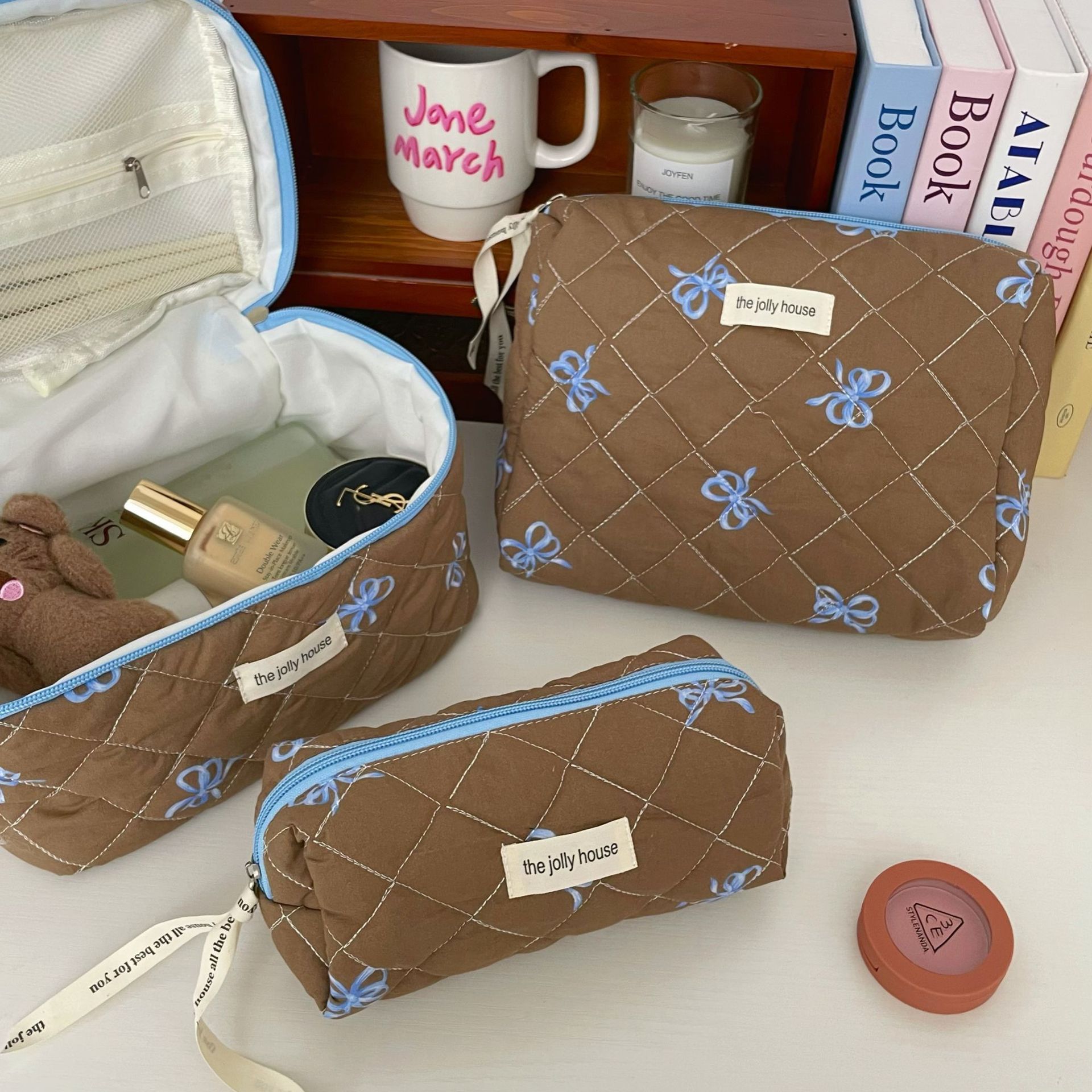 Color-blocking blue and coffee bow makeup bag, women's portable large-capacity hand-held toiletry bag, makeup and skin care product storage bag details Picture