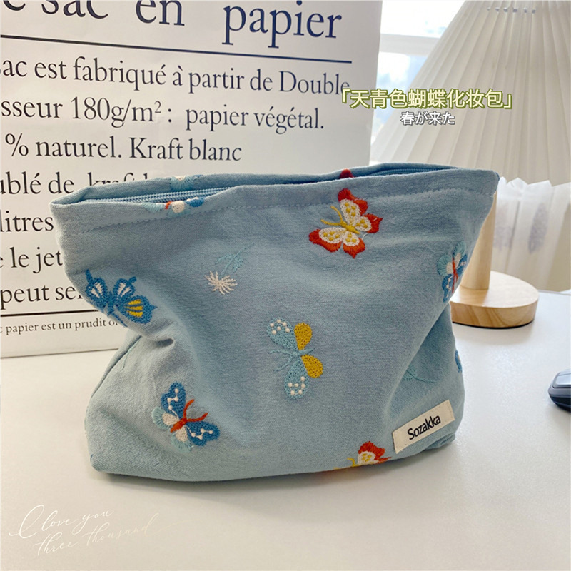 110221 Sky blue butterfly-embroidered cosmetic bag, portable zipper storage bag, easy to carry, hand in hand, a coin purse for women details Picture