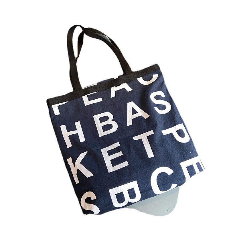 12281 Korean same style letter logo laid-back style large capacity shopping bag canvas bag wholesale in three colors Item Picture