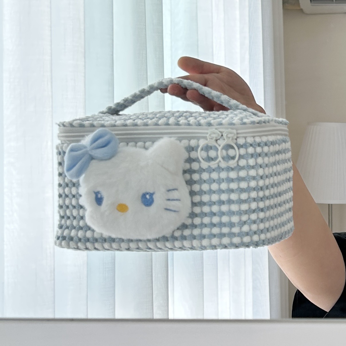 Cute blue cat makeup bag with a cute chanel-style design, portable large-capacity travel toiletries bag, and cosmetics storage bag Application Scenario
