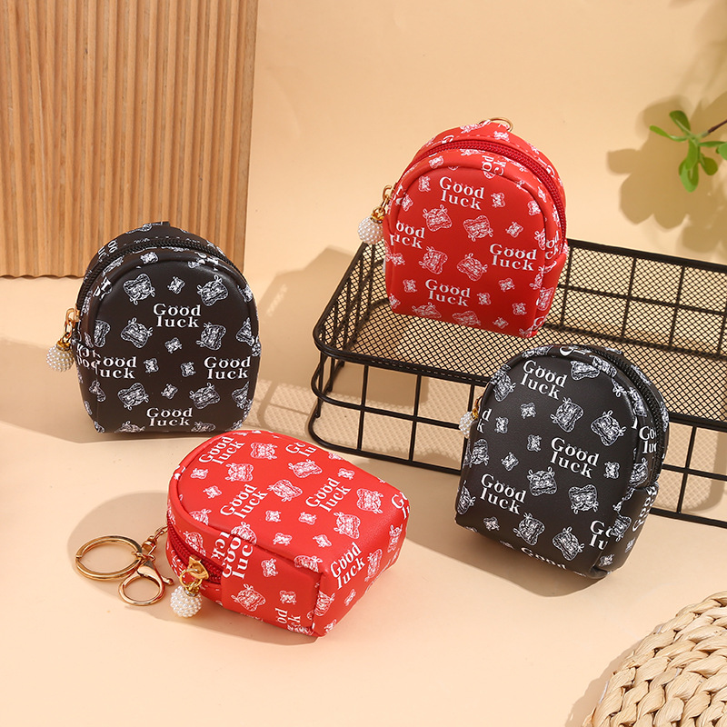 This mini and high-end coin purse for women is compact and convenient. It can carry Chinese-style headphones and keys with you. The small bag can be hung full figure