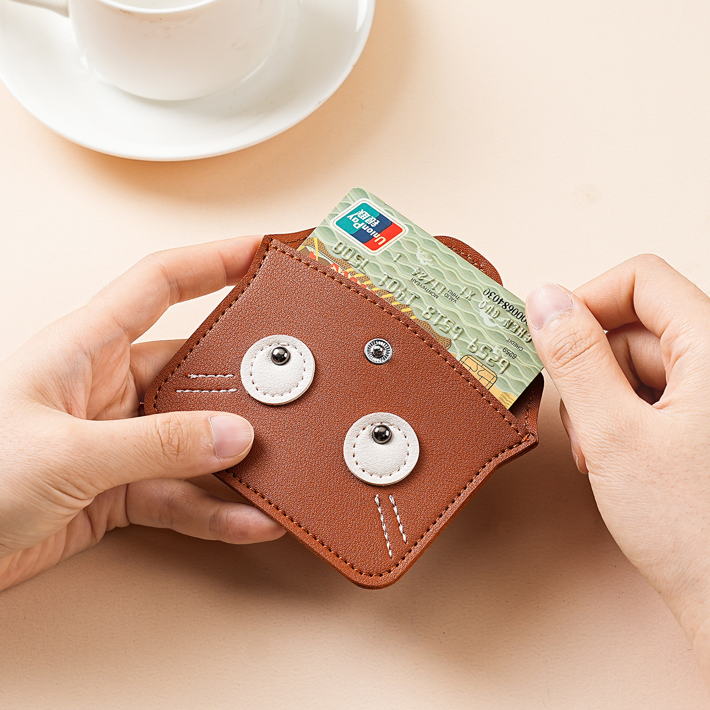 The 2025 new minimalist women's genuine leather neck-neck coin purse, with a high-end feel and a cute cartoon mini card case, is a trendy storage bag Application Scenario