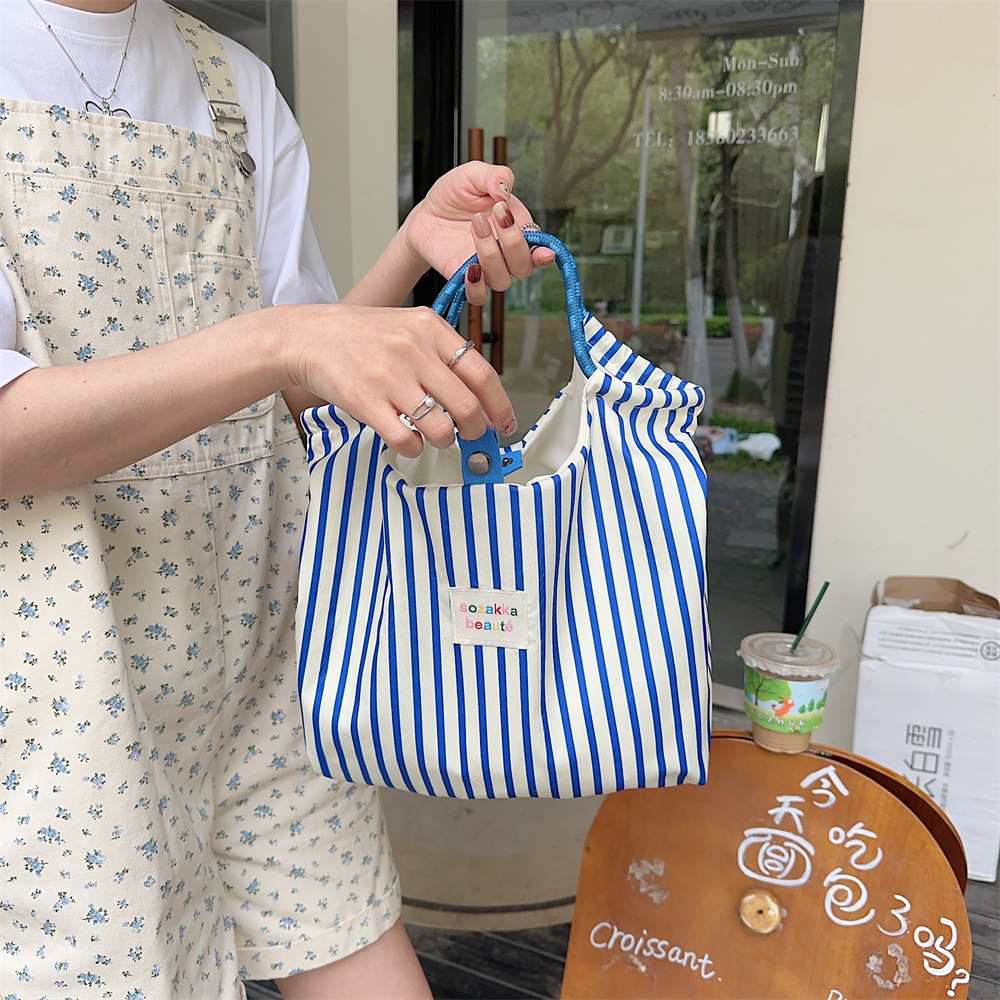 44181 Korean embossed cartoon canvas bag for women, large-capacity hand-carry bag for shopping, work and commuting details Picture