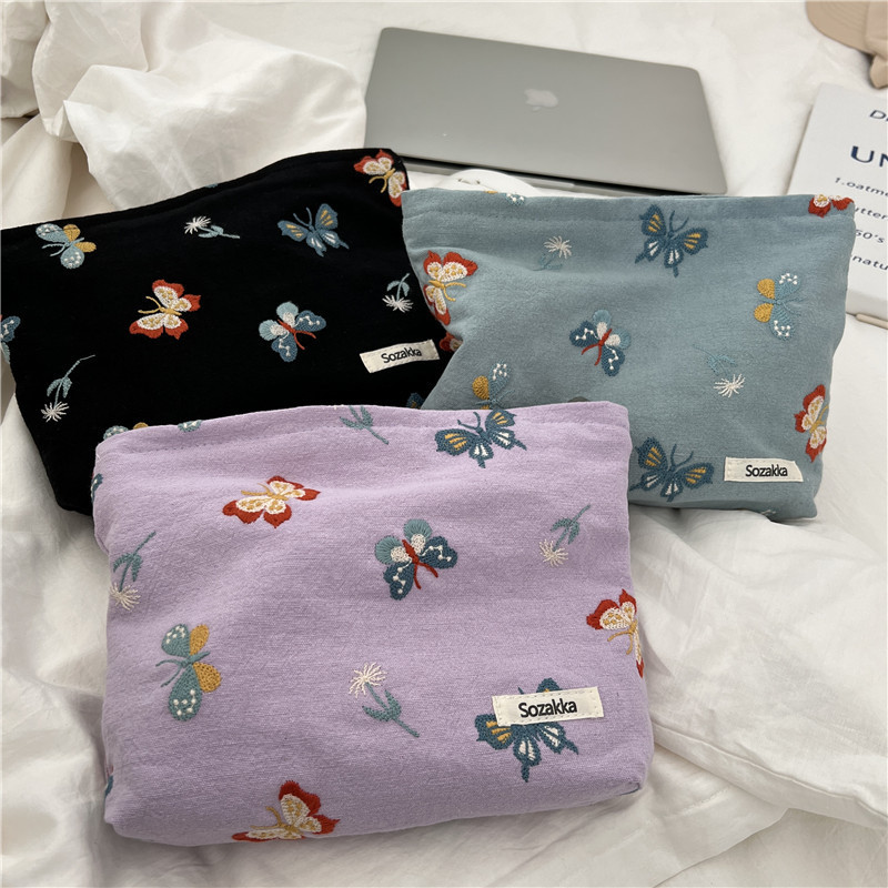 110221 Sky blue butterfly-embroidered cosmetic bag, portable zipper storage bag, easy to carry, hand in hand, a coin purse for women full figure