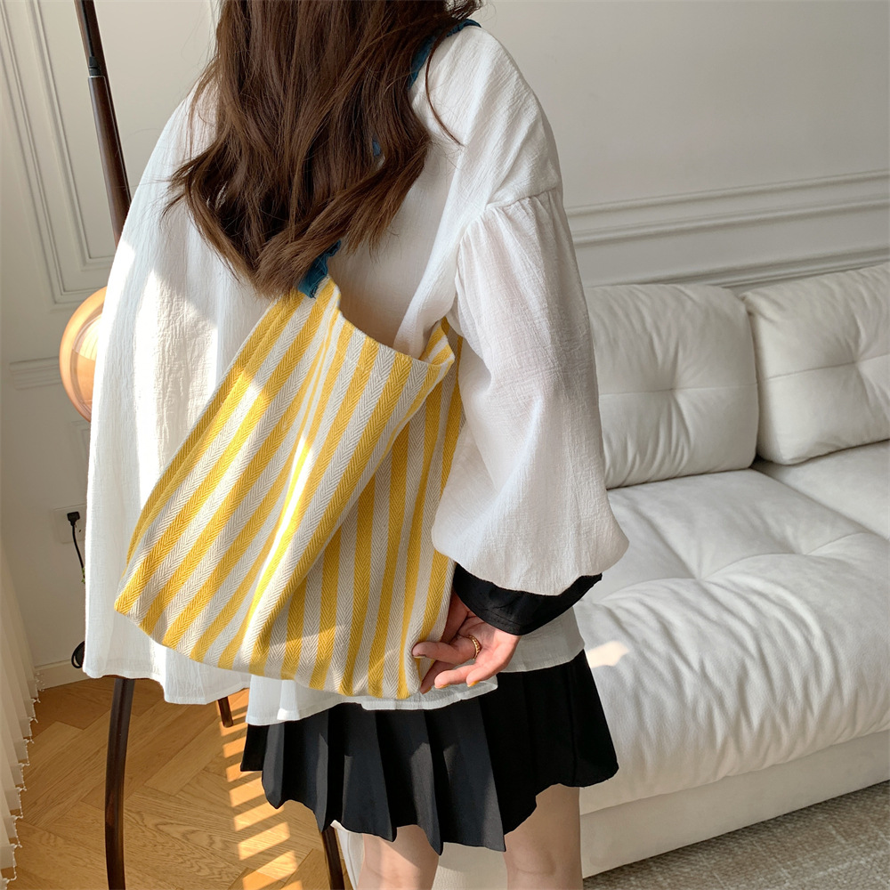 38171 Summer fresh and simple single-shoulder canvas bag, new color contrast striped large-capacity pleated shoulder strap tote bag details Picture