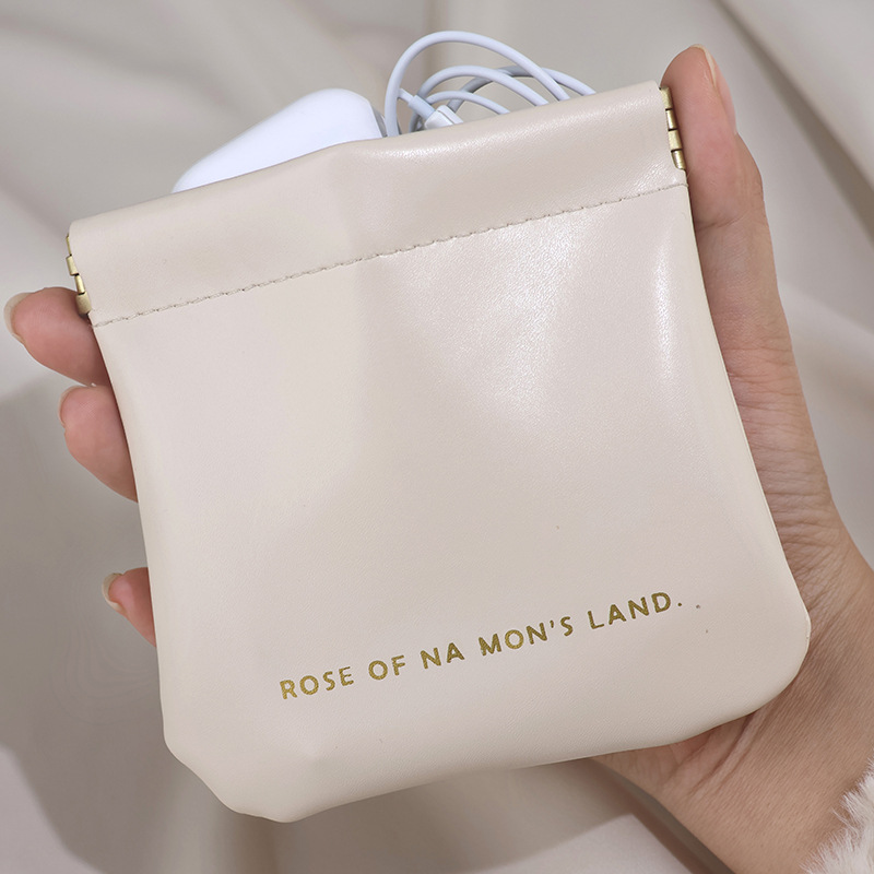 A portable mini travel pocket, a light luxury key, loose change, data cable storage bag, red envelope and makeup storage bag full figure