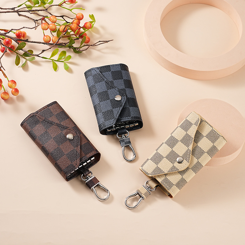 A unisex car key case for both men and women, a creative, fashionable and simple household key storage case with a keychain hanging decoration Application Scenario