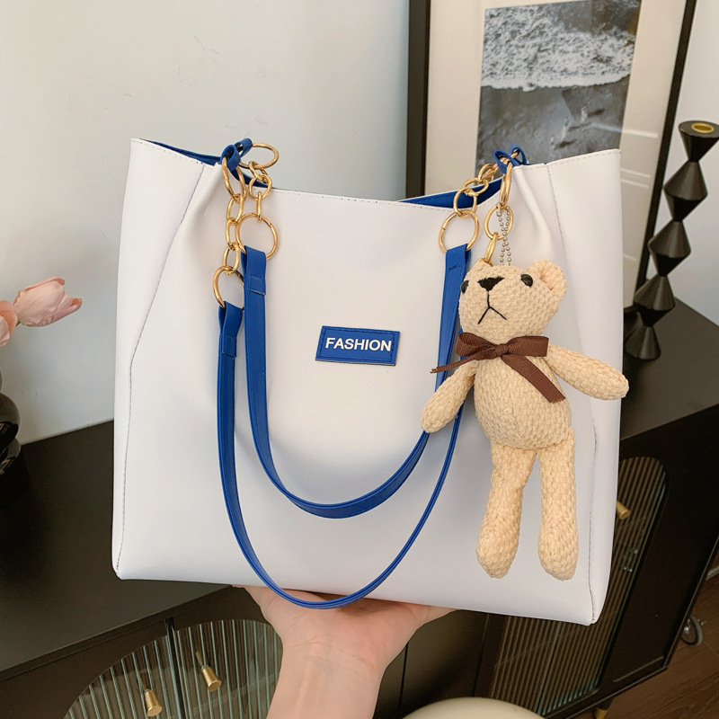 The 2024 new cross-border women's bag features a European and American style single-shoulder bag, a trendy and simple tote bag, and a color-matched commuting bag full figure