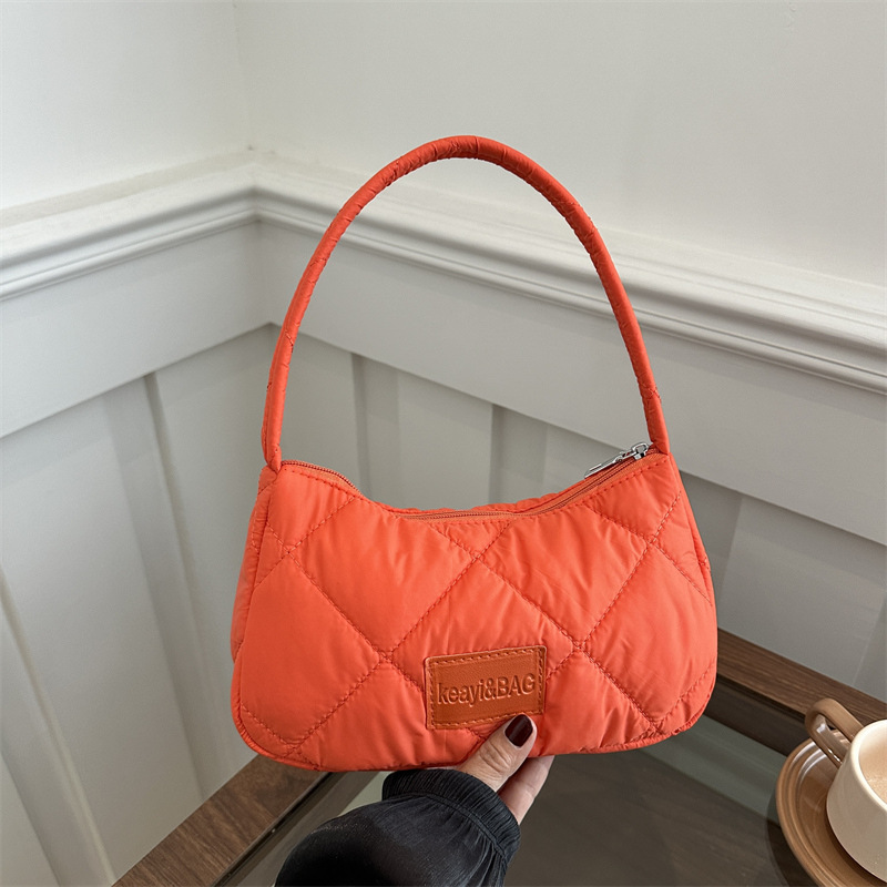 This year, large-capacity cotton-padded jackets for women are in vogue. The new 2024 fashionable canvas lightweight commuting single-shoulder dumpling bag for women is in vogue full figure