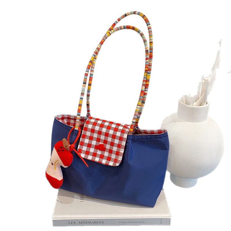 A portable and versatile denim mint small handbag with bottom straps on both sides - a large-capacity single-shoulder commuting bag Application Scenario