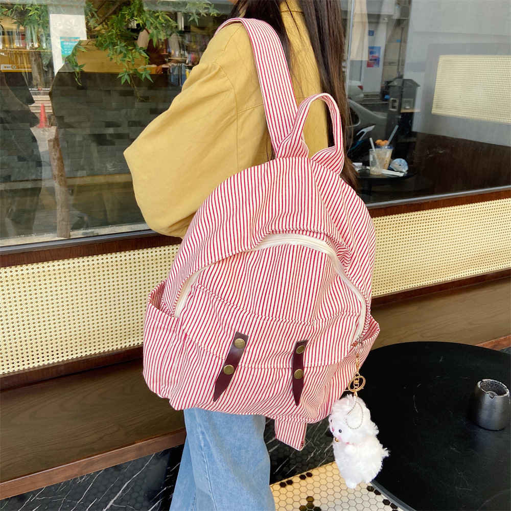 01042 Student casual backpack, simple color-blocking striped canvas bag, versatile large-capacity bag, travel backpack Application Scenario