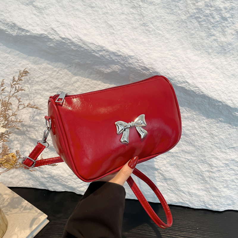 This year, a trendy Korean-style bow leather single-shoulder bag for women's 2024 winter commuting crossbody is in fashion full figure