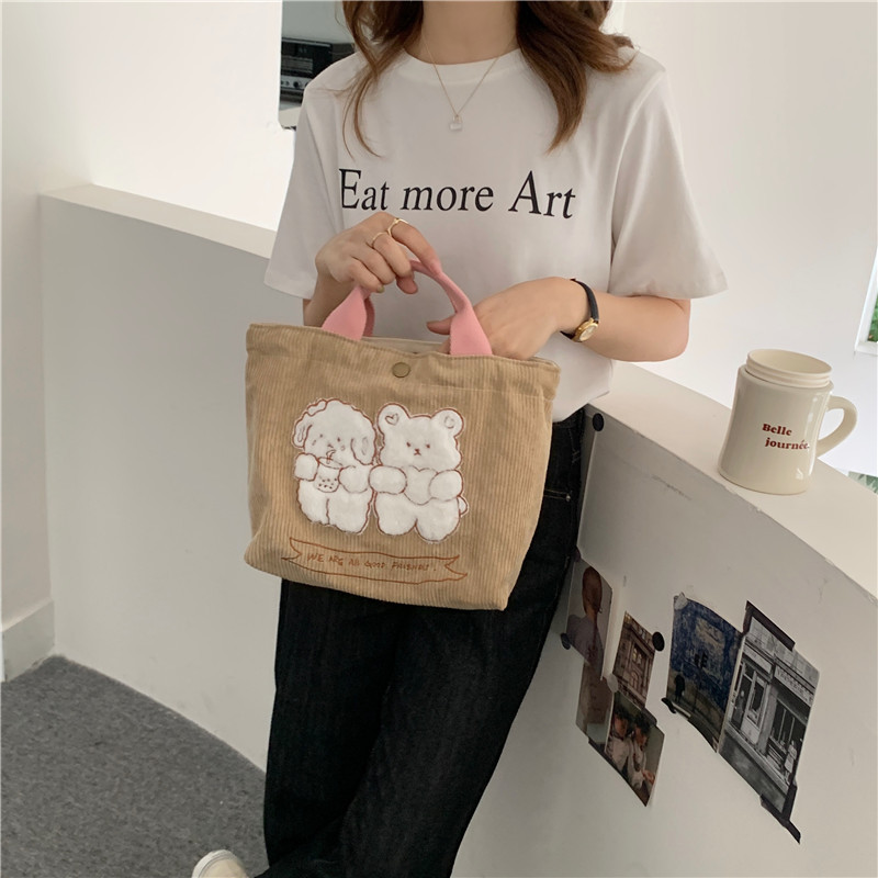 1991 Cute cartoon embroidered hand-held canvas bag, corduroy tote bag, student mommy commuting lunch bag wholesale Application Scenario