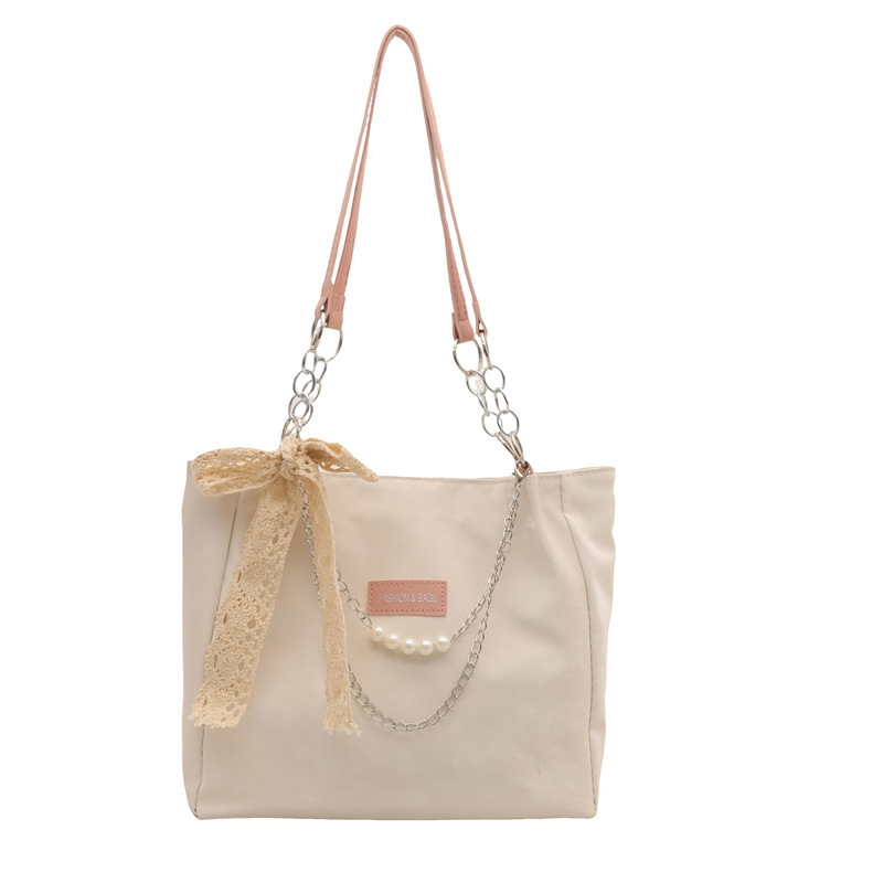 The new Korean version of the women's single-shoulder bag features a unique design and a high-end underarm bag. It is a fashionable and niche hand-held tote bag for women Item Picture